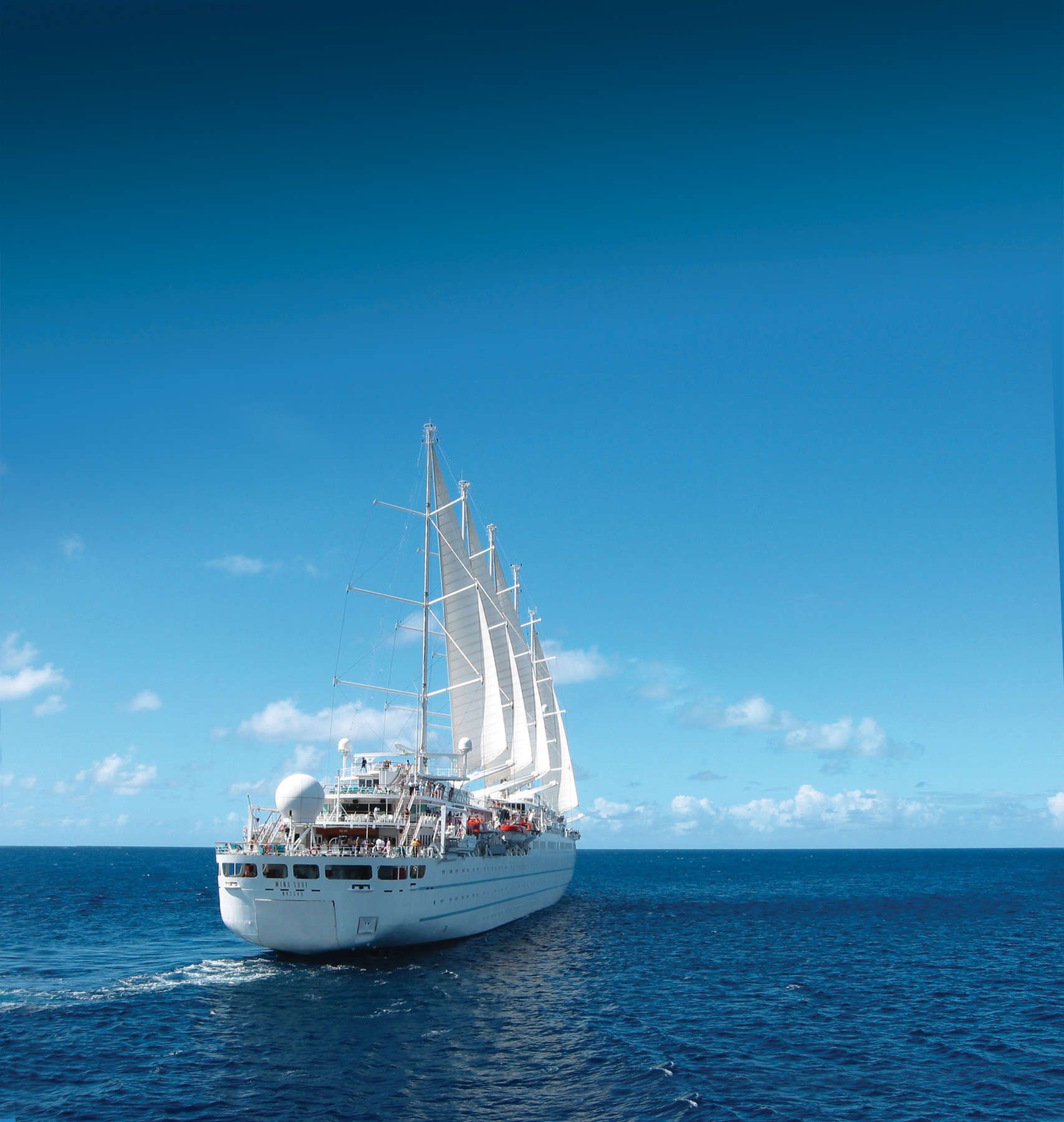Luxury sailing cruise ship at sea for solo and single travelers on an Adventures for Solo Travelers by Suzy Davis group vacation, offering a relaxed and social ocean cruising experience.