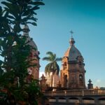 Historic San Ignacio Church in Medellín, Colombia, featuring twin bell towers and colonial architecture, visited on the Adventures for Solo Travelers Colorful Colombia small group tour for travelers age 45 and over.