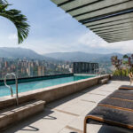 York Luxury Suites rooftop pool with panoramic views of Medellín and the surrounding mountains on an Adventures for Solo Travelers Colombia adventure.